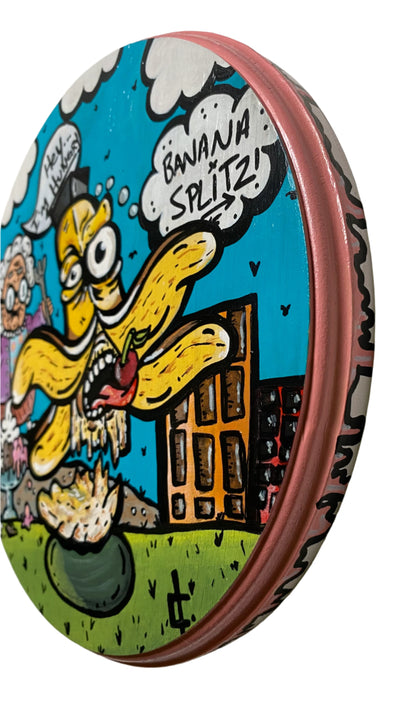 Colorful cartoon illustration painting on wood with acrylic of a graham chasing a banana and ice cream in the distance saying im hungry. Painting done Edmonton Artist Carly Marie 8.25" round on birch wood.